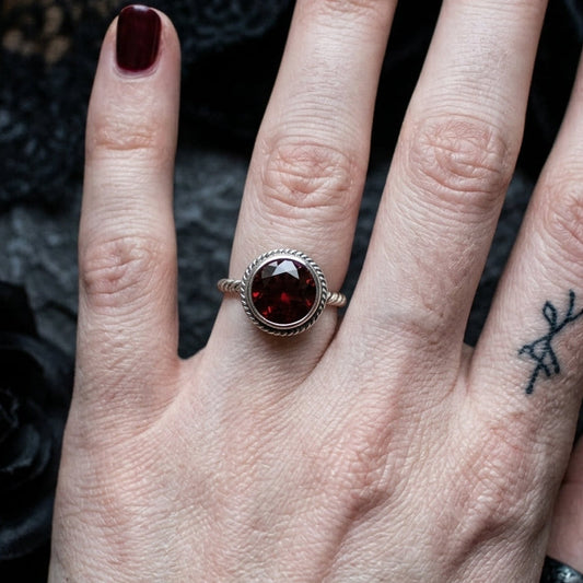 Elegant Garnet Twisted Band Ring