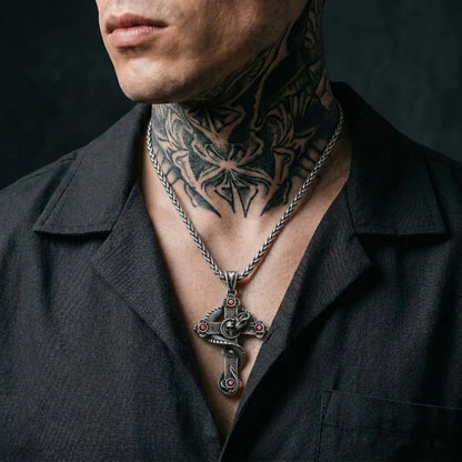 Snake and Skull Cross Necklace with Red Gemstones